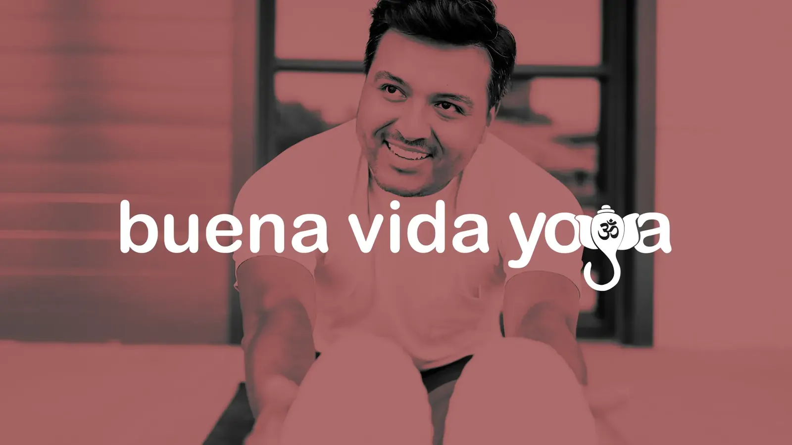 Buena Vida Yoga logo in white, with an elephant and om symbol in the letter g, over a red-tinted photo of a smiling man stretching